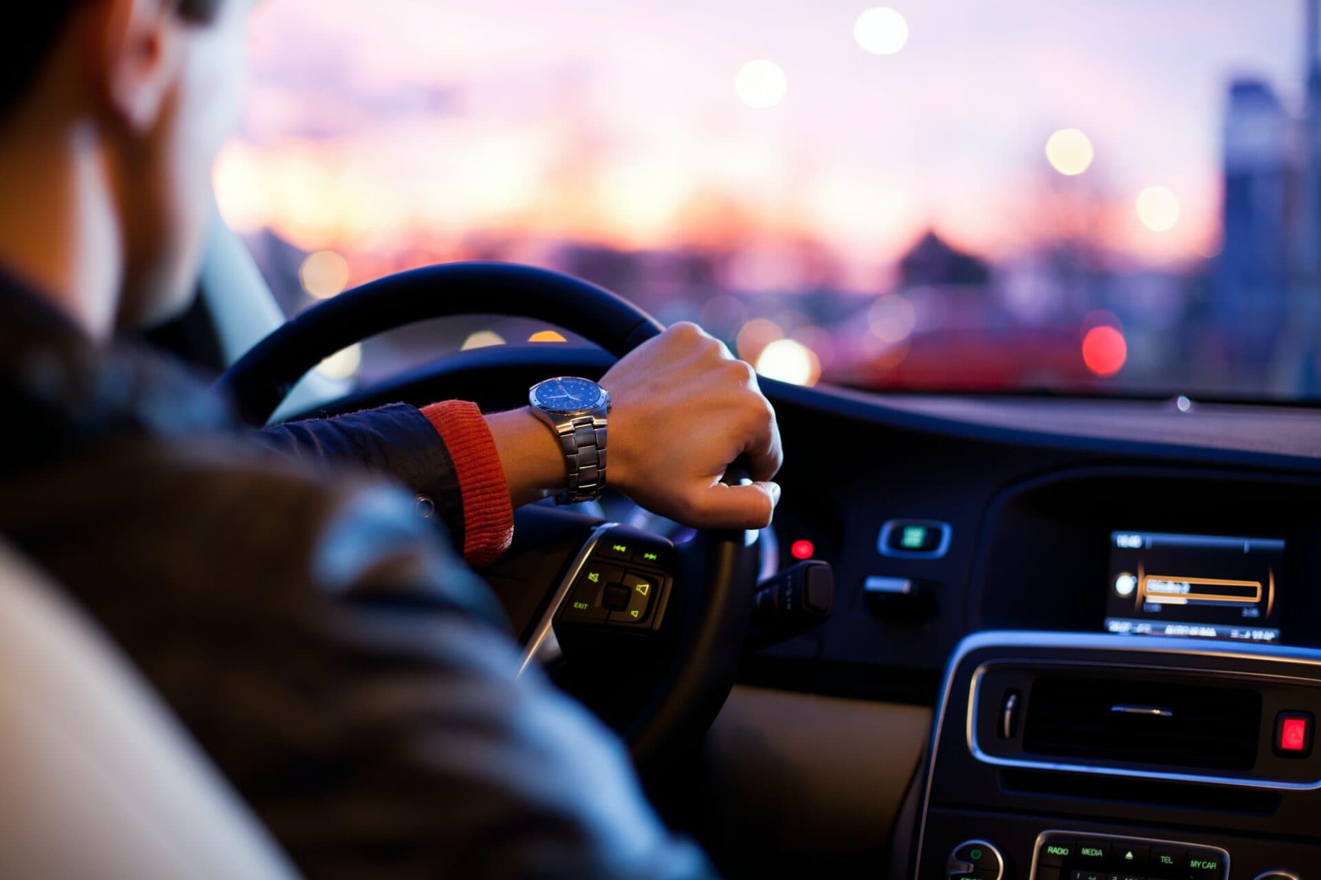 Man driving car during evening