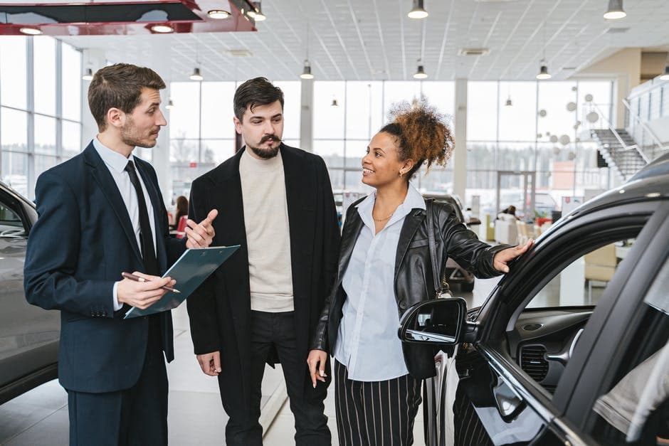 couple buying from dealer