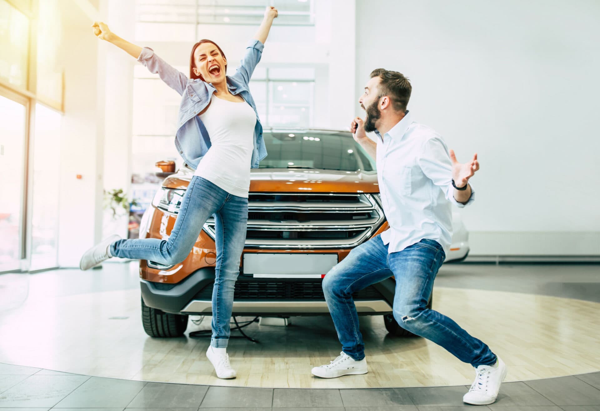Couple jumping in front of car!